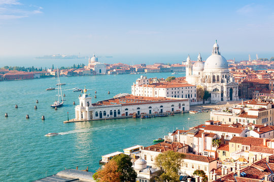 Aerial view of Venice, Santa Maria della Salute with Guidecca during early morning summer day. World famous Venice landmark. View from St Mark Campanile.