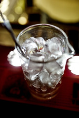 Ice in glass on the bar counter
