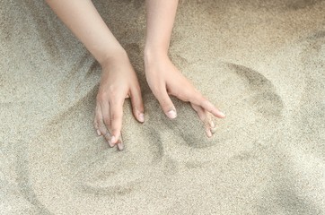 hands and sand