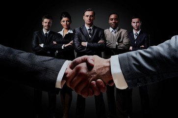 handshake on the background group of business people.