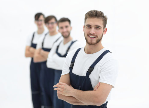 Cheerful team of responsible movers isolated on white background