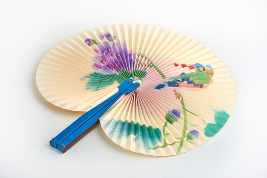 Closeup of Traditional Chinese paper fan on white background.Hand paper fan