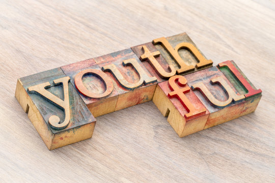 youthful word abstract in wood type