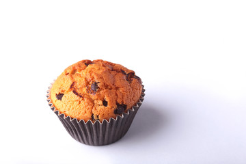 Tasty chocolate cupcakes, muffins on a white wooden table