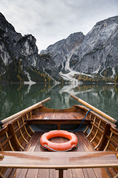 Empty boat on lake against mountain