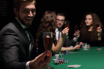 poker player with a glass of wine