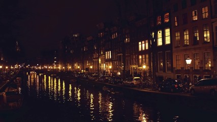 Fototapeta premium City canal at night. Amsterdam, Netherlands