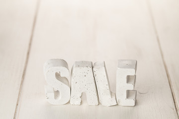 concrete letters on a wooden board