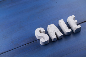 beton letters on a wooden board