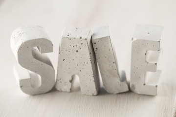 concrete letters on a wooden board