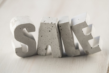 concrete letters on a wooden board