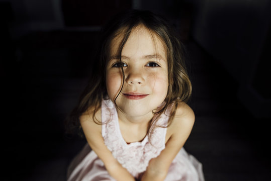 High angle portrait of smiling girl at home