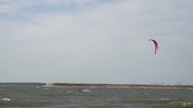 Novosibirsk. Russia- September 15, 2017: Kite surfer doing sport at the Sea coast