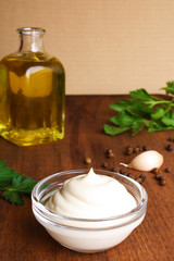 mayonnaise sauce on a wooden background cooking