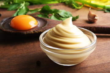 mayonnaise sauce on a wooden background cooking