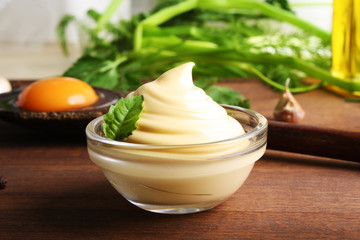 mayonnaise sauce on a wooden background cooking