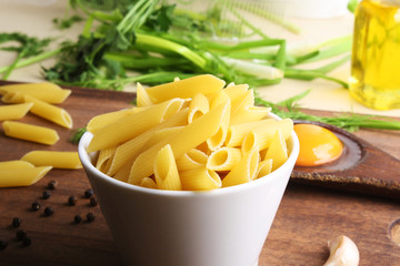 Penne rigate. Macaroni in the form of feathers. mostaccioli pasta
