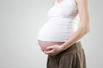 Pregnant woman belly - studio shot