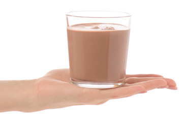 A glass of chocolate milk cocoa in hand