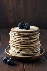 Chocolate pancakes with blackberries.