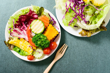 Top view of mixed vegetables salad on white dish ready for eating, healthy food