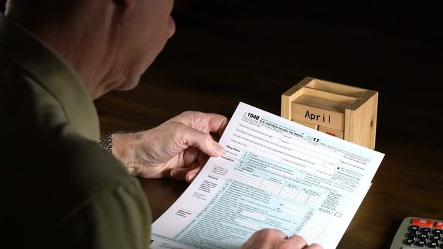 Senior adult man with tax return date of April 17, 2018 - Powered by Adobe