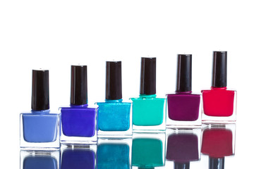 Bottles with nailpolish on white background