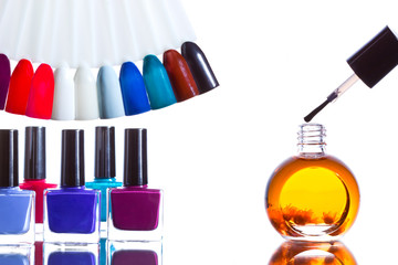 Samples of colored nail polish and bottles with nailpolish.