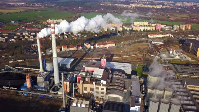 Aerial view of steelworks in industrial zone. Factory chimneys smoking in city Pilsen, Czech republic, European union. Heavy industry from above.