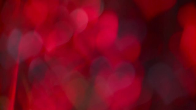 Red hearts blue light flickers, a blurred movement. Bokeh background