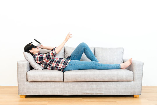 leisure woman lying down on wooden floor sofa