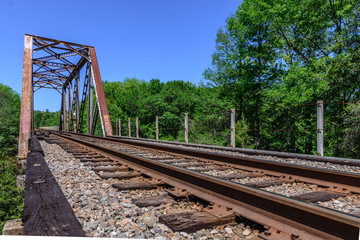 Fototapeta na wymiar Old metal truss railroad bridge in florida