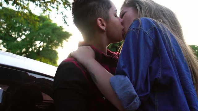 Lesbian Couple Kissing in Car - Sunset Time