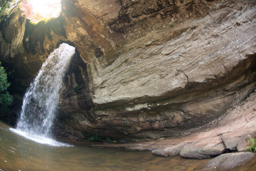Sang Chan Waterfall is sometimes called Namtok  Long Ru ( Waterfall Through a Hole ).Located Ubon Ratchathani Province,Thailand.