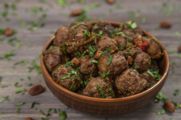 Traditional Italian meatballs Polpette in a ceramic bowl. 