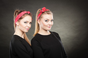 Portrait of retro pin up girls in red handkerchief.