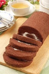Swiss Roll  on the wooden cutting board      