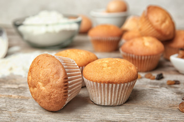 Delicious cupcakes on wooden table, closeup