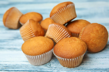 Delicious cupcakes on wooden table, closeup