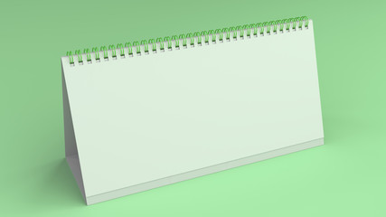 White table calendar mock-up on green surface