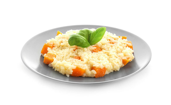 Plate with delicious pumpkin risotto on white background