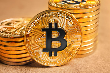 Golden bitcoins on color background, closeup