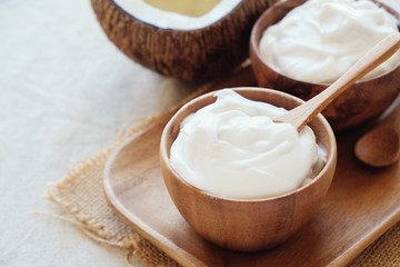 homemade organic coconut greek yogurt in wooden bowl, probiotics food for gut health, keto,...