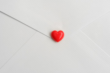 Valentines heart on white envelop. Happy Valentines Day background. Can be used for celebrations valentines day.