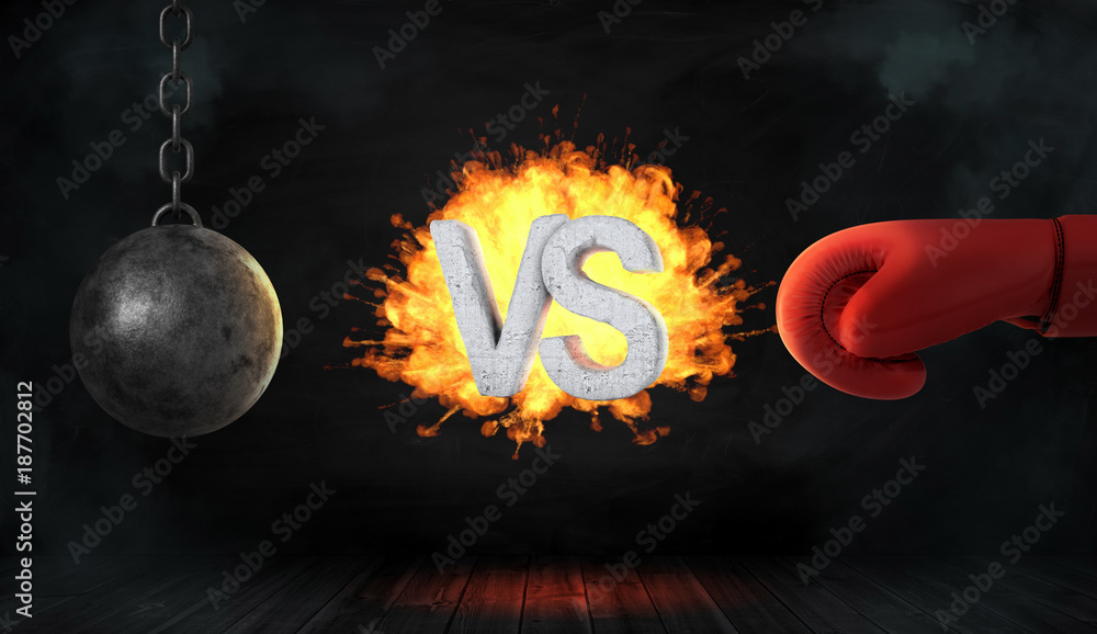 Poster 3d rendering of a concrete letters vs caught on fire between a wrecking ball and a red boxing glove.