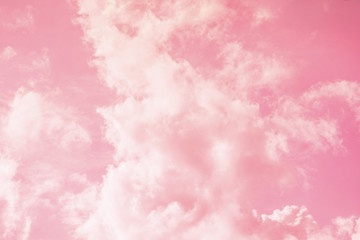 Pink sky background with white clouds.