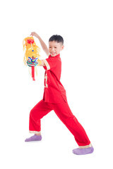 Young chinese boy in red color traditional dress playing chinese lion puppet over white background