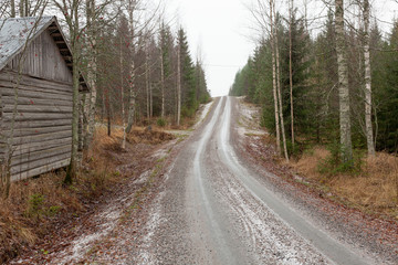 Small frozen forest road in finland