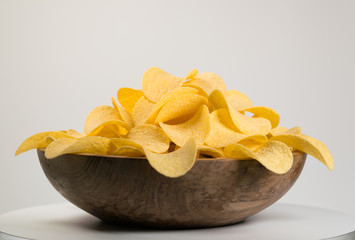 potato chips in a wooden bowl