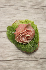 Sandwich with sausage in form of rose